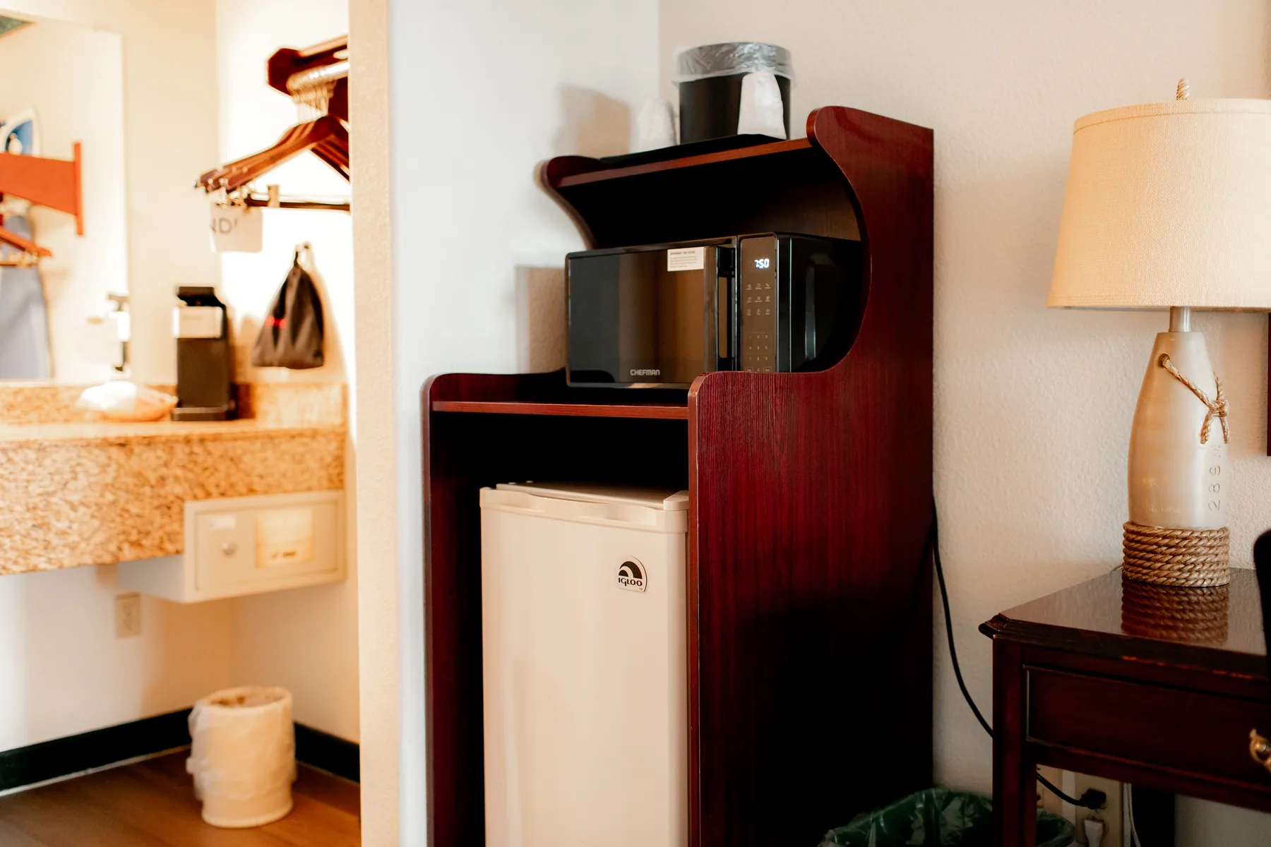 Coffee maker, lamp, and vanity area
